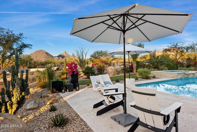 view of property's community with a gazebo and a patio area