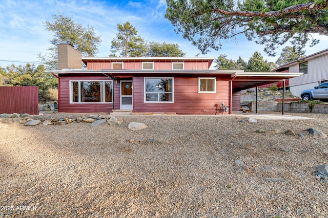 view of front of property featuring a carport