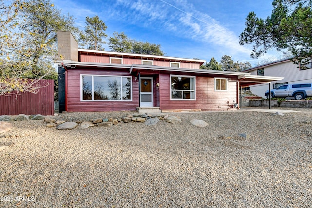 view of front of home featuring a carport