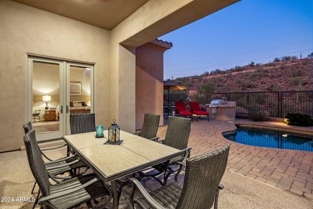 view of patio / terrace with a fenced in pool