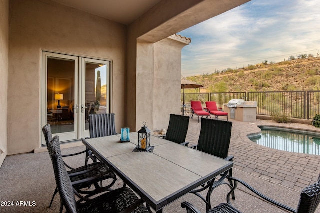 view of patio / terrace with a fenced in pool