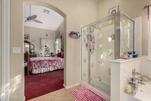 bathroom featuring tile patterned floors, ceiling fan, and a shower with door