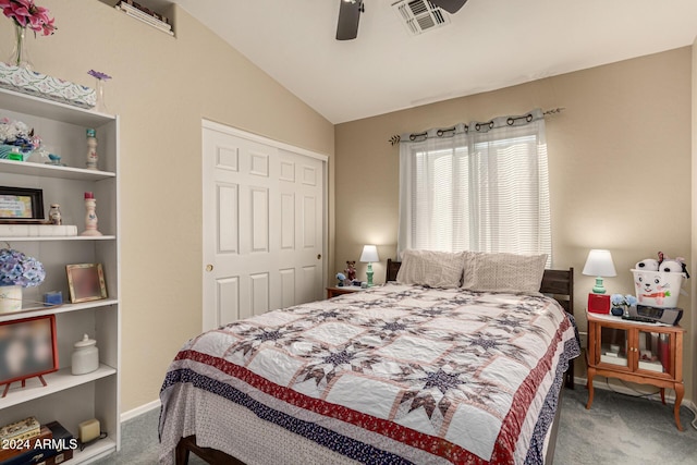 carpeted bedroom with a closet, ceiling fan, and lofted ceiling