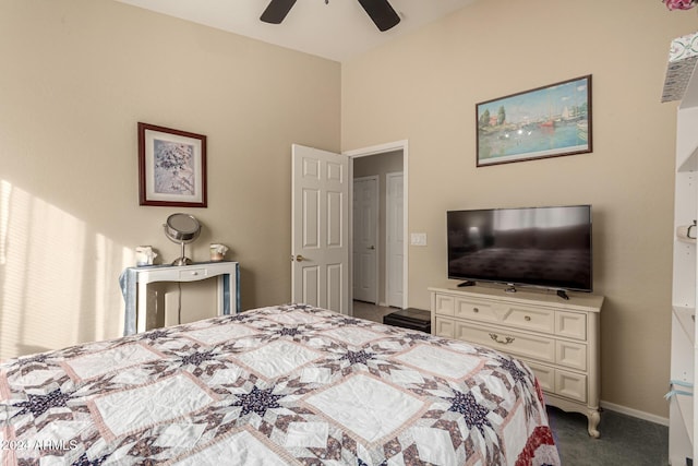 bedroom featuring ceiling fan and dark colored carpet