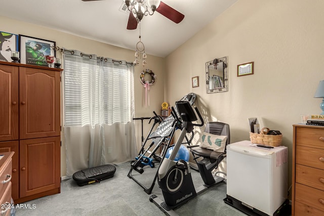 exercise area featuring carpet floors, ceiling fan, and lofted ceiling