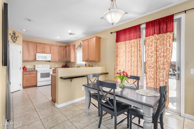 33335 N Slate Creek Dr, San Tan Valley, AZ 85143 - dining area featuring recessed lighting, light tile patterned floors, and baseboards