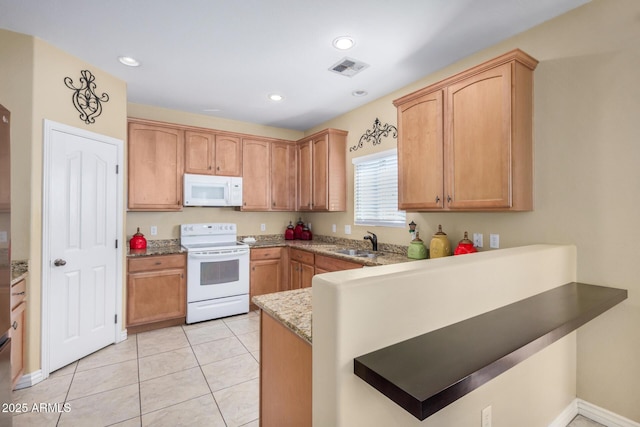 33335 N Slate Creek Dr, San Tan Valley, AZ 85143 - kitchen with white appliances, light tile patterned floors, a peninsula, visible vents, and a sink