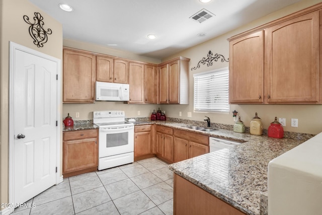 33335 N Slate Creek Dr, San Tan Valley, AZ 85143 - kitchen with visible vents, a sink, white appliances, recessed lighting, and light stone countertops