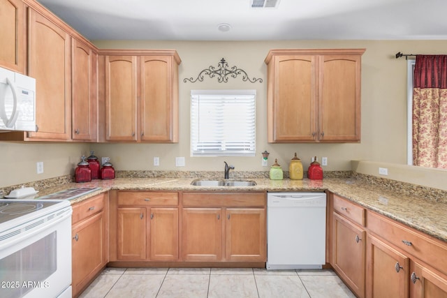 33335 N Slate Creek Dr, San Tan Valley, AZ 85143 - kitchen featuring light stone counters, white appliances, light tile patterned floors, visible vents, and a sink