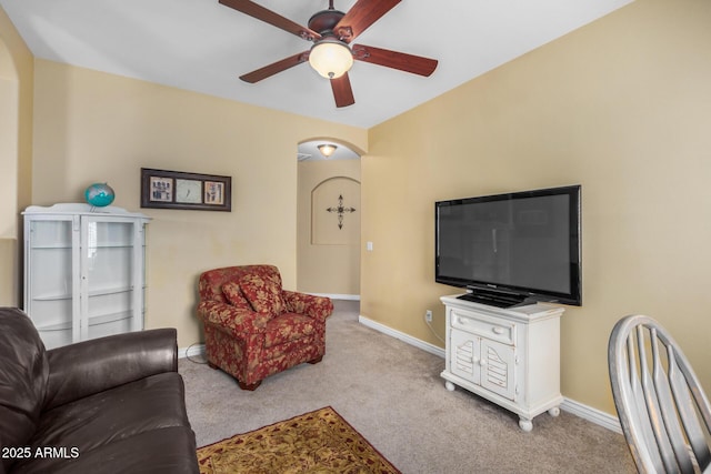33335 N Slate Creek Dr, San Tan Valley, AZ 85143 - living area with arched walkways, carpet flooring, ceiling fan, and baseboards