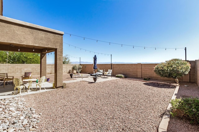 33335 N Slate Creek Dr, San Tan Valley, AZ 85143 - view of yard with a fenced backyard and a patio