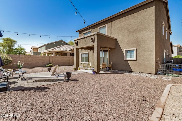 33335 N Slate Creek Dr, San Tan Valley, AZ 85143 - back of property featuring a patio area, a fenced backyard, and stucco siding