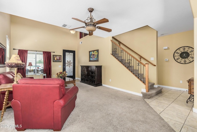 33335 N Slate Creek Dr, San Tan Valley, AZ 85143 - carpeted living area with ceiling fan, a towering ceiling, visible vents, stairs, and baseboards