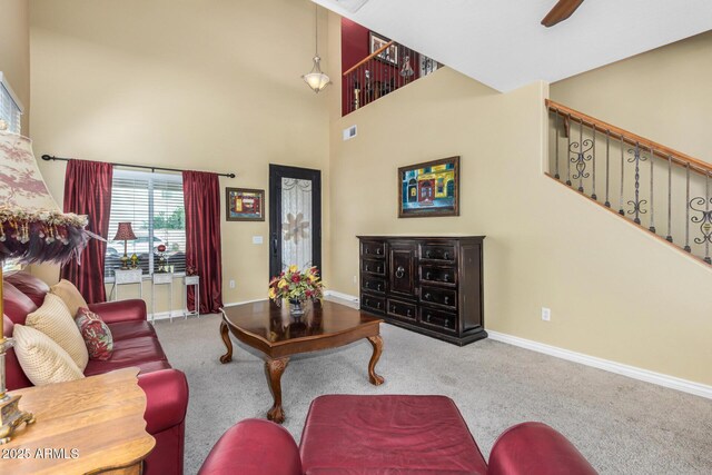 33335 N Slate Creek Dr, San Tan Valley, AZ 85143 - living area featuring baseboards, carpet flooring, a high ceiling, stairs, and ceiling fan