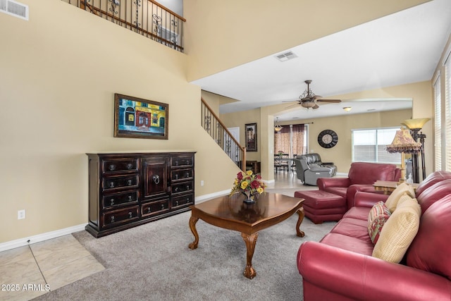 33335 N Slate Creek Dr, San Tan Valley, AZ 85143 - living room featuring baseboards, a ceiling fan, visible vents, and stairway