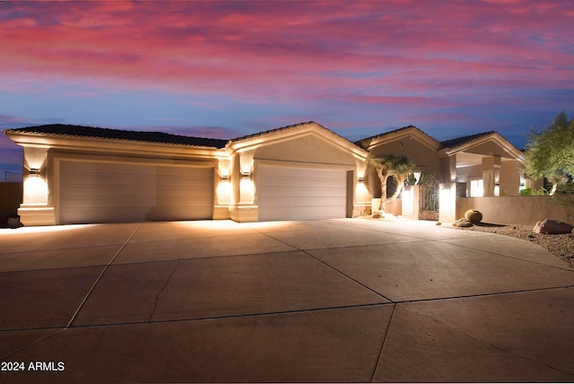 ranch-style home featuring a garage