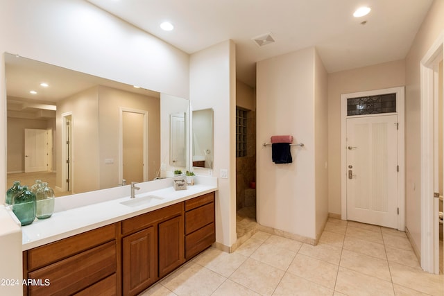 bathroom featuring vanity with extensive cabinet space and tile flooring