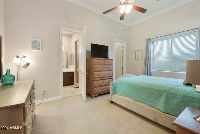 carpeted bedroom with ornamental molding, ceiling fan, and ensuite bathroom