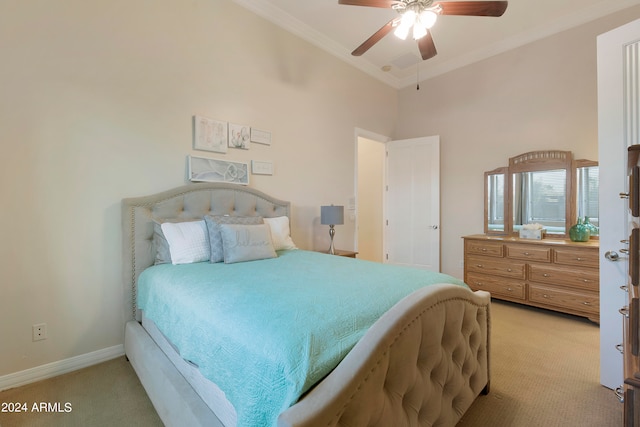 bedroom featuring ornamental molding, ceiling fan, carpet flooring, and a high ceiling