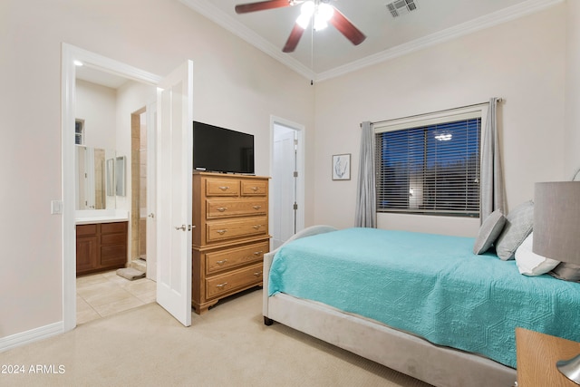 carpeted bedroom featuring ceiling fan, ensuite bathroom, and ornamental molding