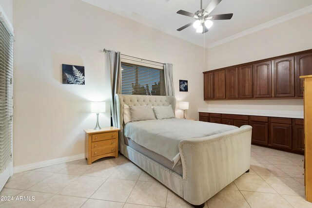 bedroom with ceiling fan, crown molding, and light tile floors