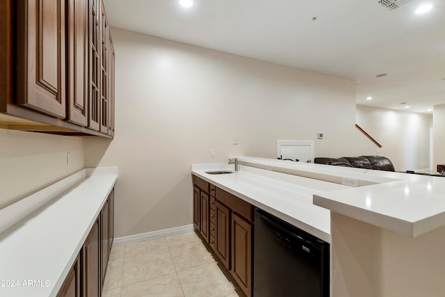 kitchen featuring kitchen peninsula, sink, dishwasher, dark brown cabinetry, and light tile floors