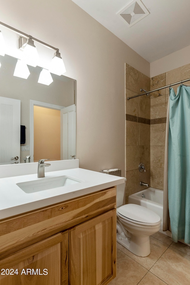 full bathroom with shower / bath combo with shower curtain, toilet, tile flooring, and vanity