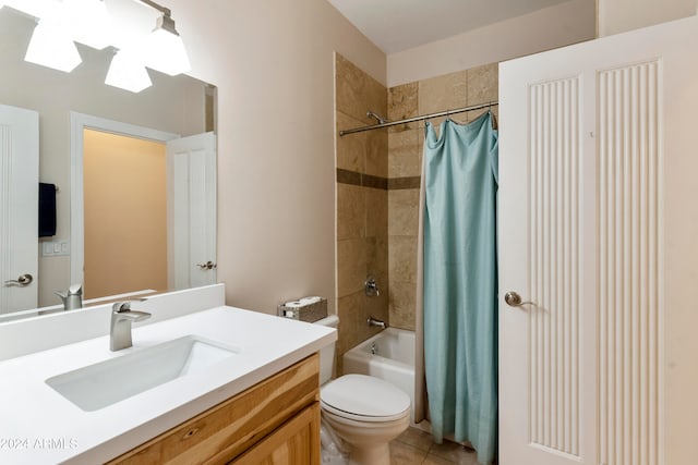 full bathroom featuring tile floors, vanity with extensive cabinet space, toilet, and shower / tub combo with curtain