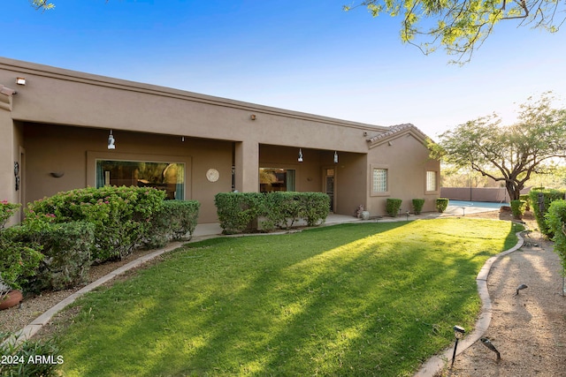 view of front of property with a front lawn