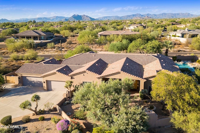 birds eye view of property featuring a mountain view