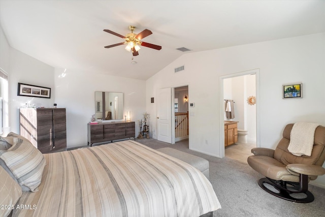 bedroom with visible vents, light colored carpet, ceiling fan, and vaulted ceiling