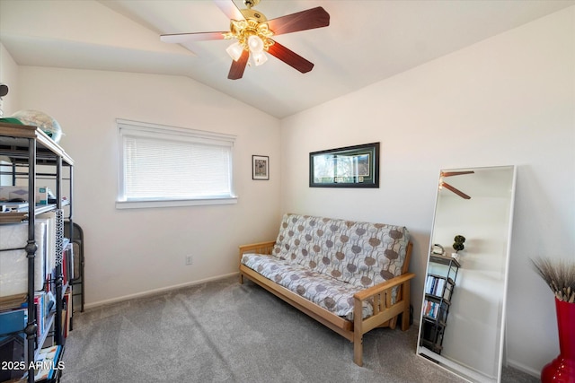 sitting room featuring lofted ceiling, a ceiling fan, baseboards, and carpet floors