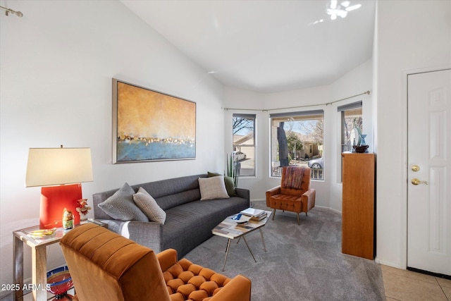 carpeted living room with tile patterned flooring and vaulted ceiling