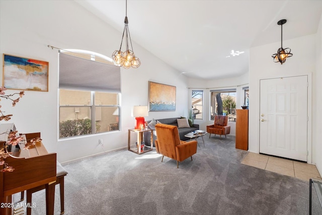 living room with tile patterned floors, carpet flooring, and high vaulted ceiling