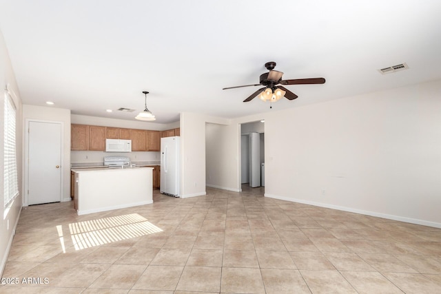 kitchen with white appliances, open floor plan, a ceiling fan, and visible vents