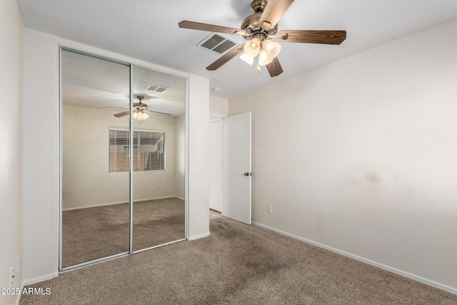 unfurnished bedroom with visible vents, a ceiling fan, a closet, carpet, and baseboards