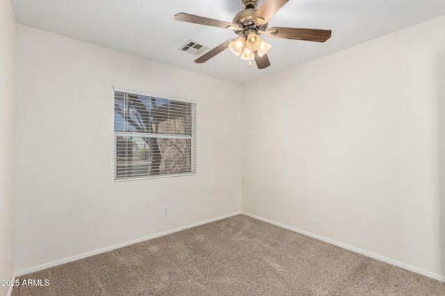 spare room with visible vents, baseboards, carpet, and a ceiling fan