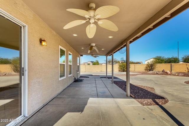 view of patio featuring a ceiling fan and a fenced backyard