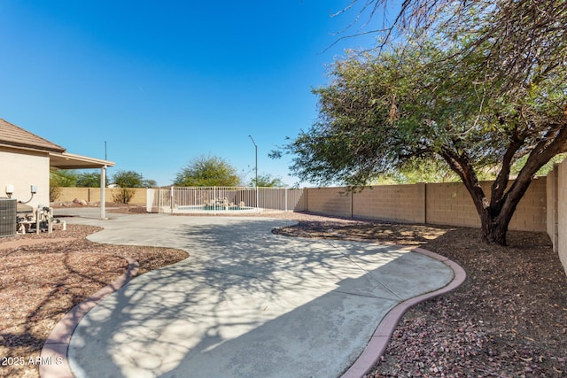 view of yard with a patio area and a fenced backyard