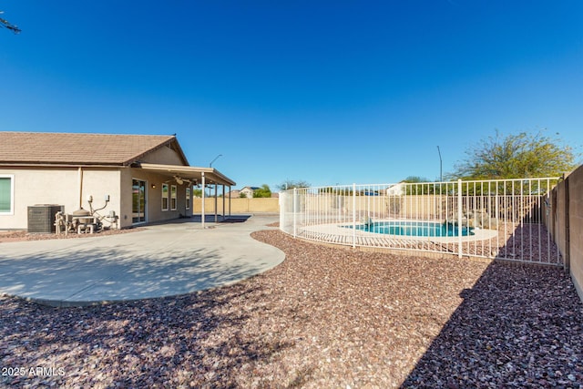 view of yard featuring a patio, central AC, and a fenced backyard