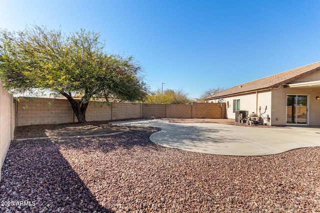view of yard with a patio and a fenced backyard