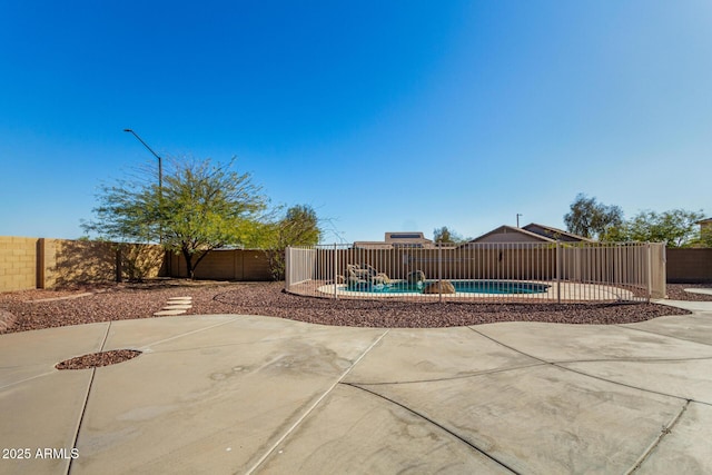 view of patio / terrace with a fenced backyard and a fenced in pool
