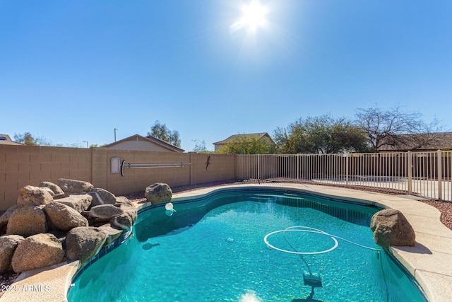 view of swimming pool with a fenced in pool and a fenced backyard