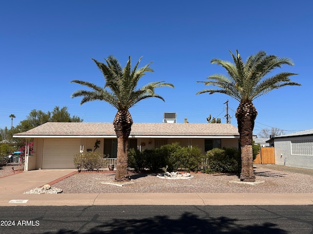 single story home with a garage