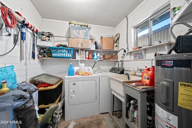 laundry room featuring electric water heater, washer and clothes dryer, and ornamental molding