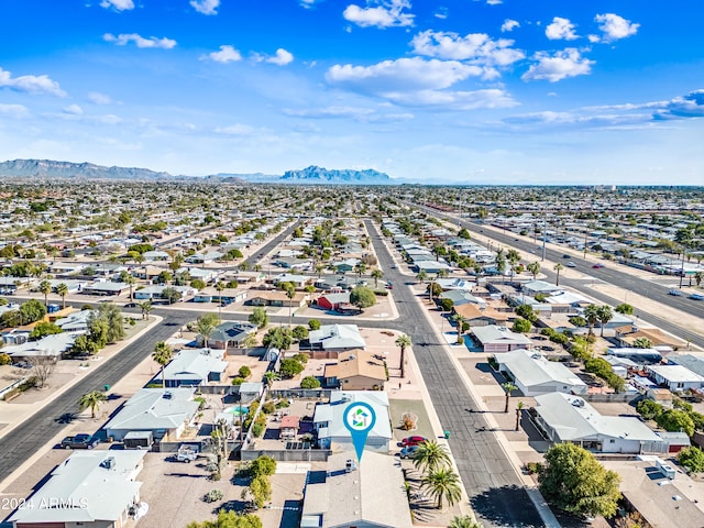 birds eye view of property featuring a mountain view