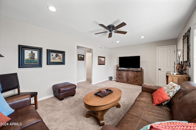 living room with light carpet and ceiling fan