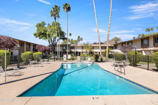 view of swimming pool with a patio