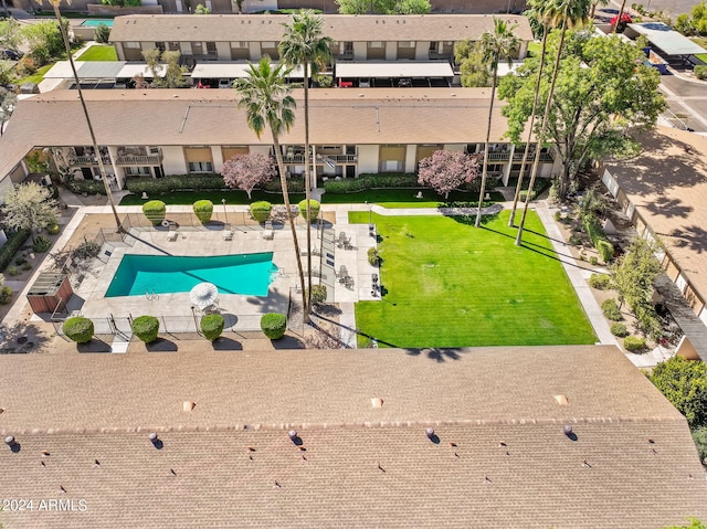 view of swimming pool featuring a lawn and a patio area