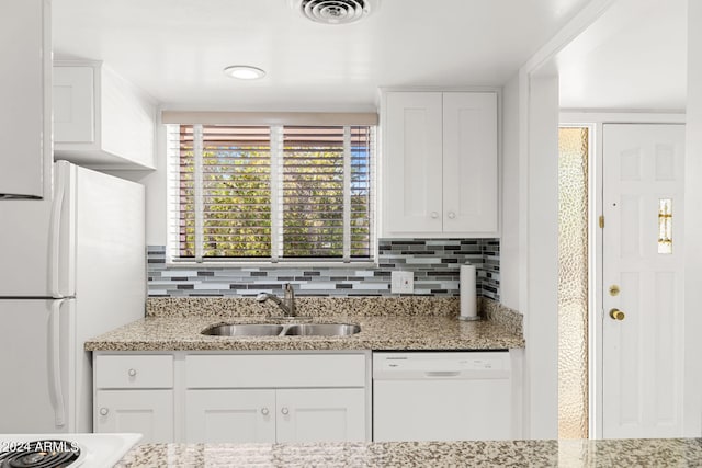 kitchen featuring white cabinets, white appliances, and sink